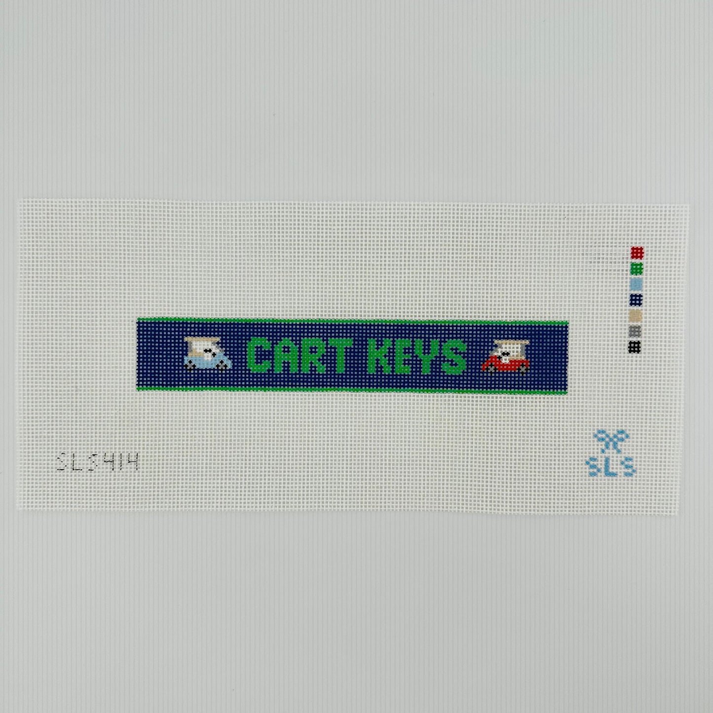 A needlepoint key fob canvas featuring a blue and green sign with the text 'CART KEYS' in green on 14 mesh lying flat on white background.