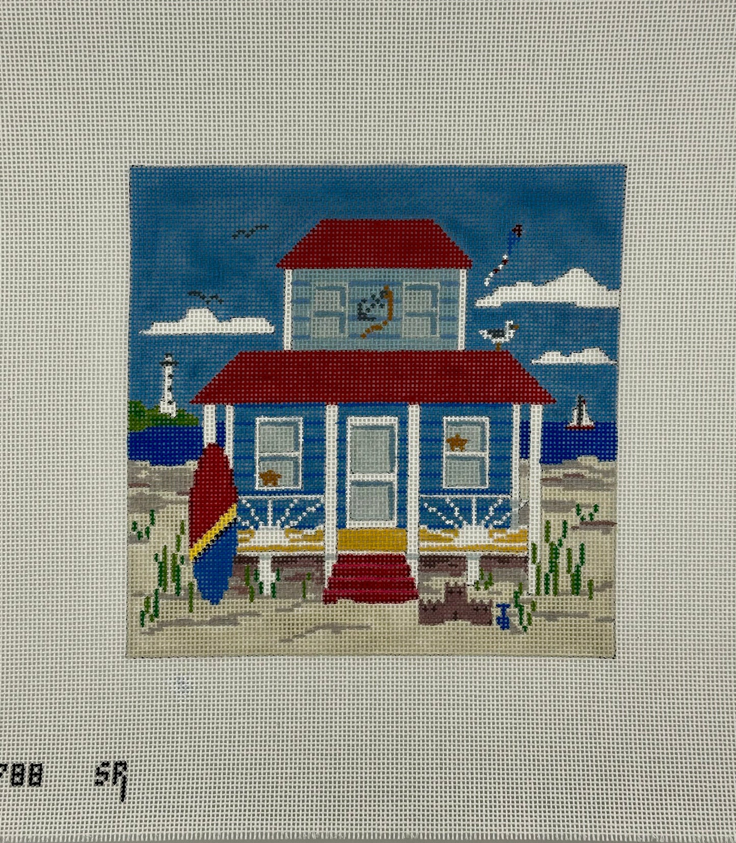 susan roberts blue beach cottage needlepoint canvas, 18 mesh, square 6.25" x 6.25" lying flat on white background