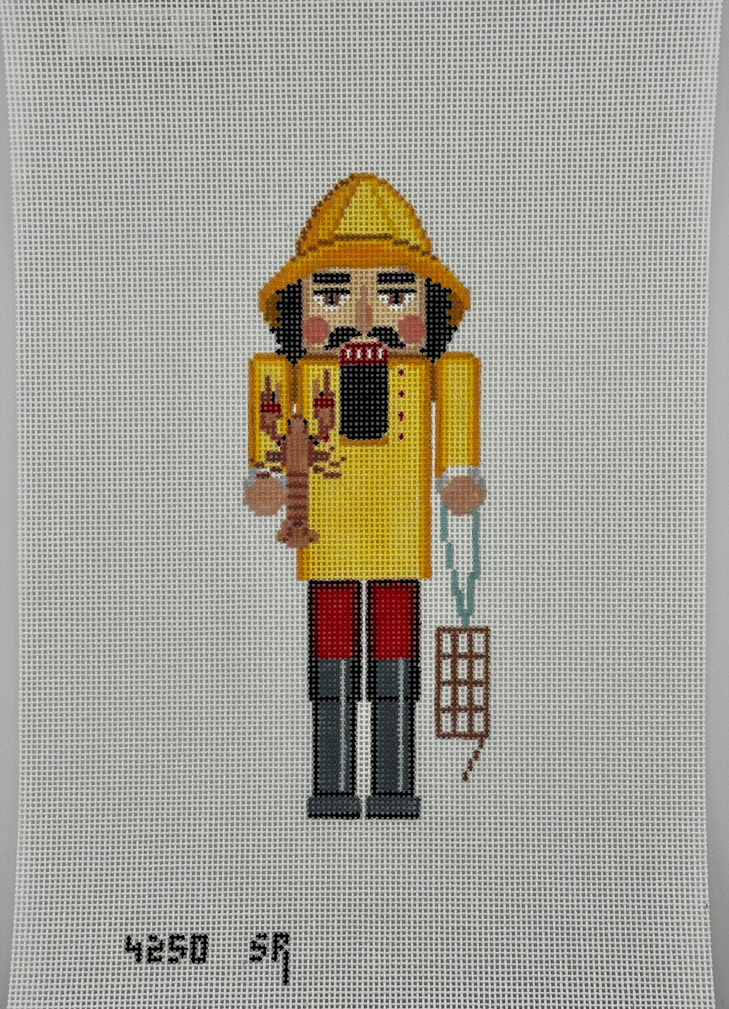 susan roberts yellow lobster catcher nutcracker canvas, 18 mesh, 6.5" high lying flat on white background