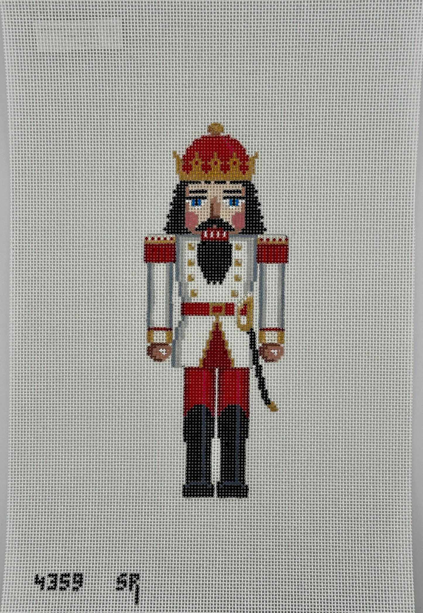 susan roberts white and red king nutcracker canvas, 18 mesh, 6.5" high lying flat on white background