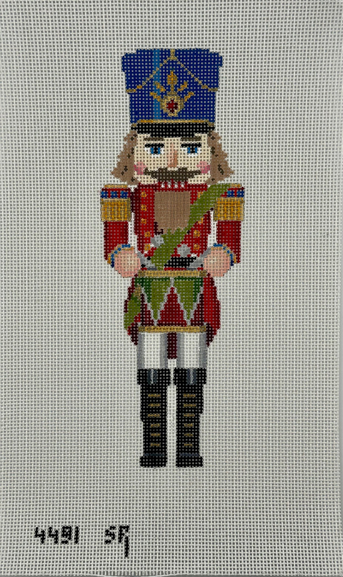susan roberts drummer nutcracker canvas, 13 mesh, 9.5" high lying flat on white background
