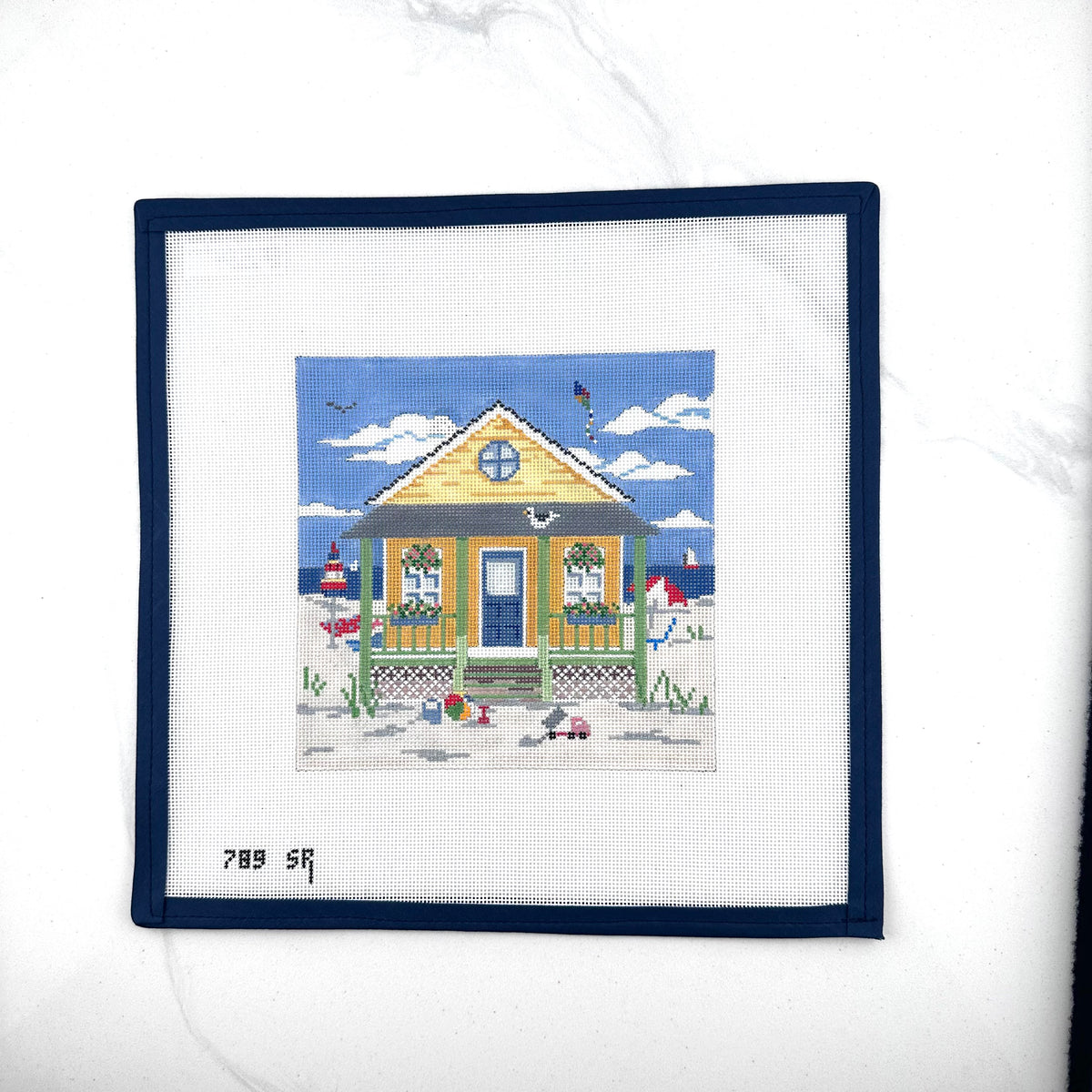susan roberts yellow beach cottage needlepoint canvas, 18 mesh, square 6.25" x 6.25" lying flat on white background