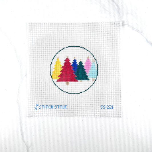 18 mesh needlepoint canvas featuring a circular design of six colorful Christmas trees in yellow, red, blue, green, pink, and light blue. The canvas has the brand name 'Stitch Style' and the number '55221' printed in blue at the bottom.