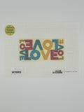 Love Canvas by Alan Claude — 18-mesh needlepoint canvas with multicolored repeating word pattern on yellow background