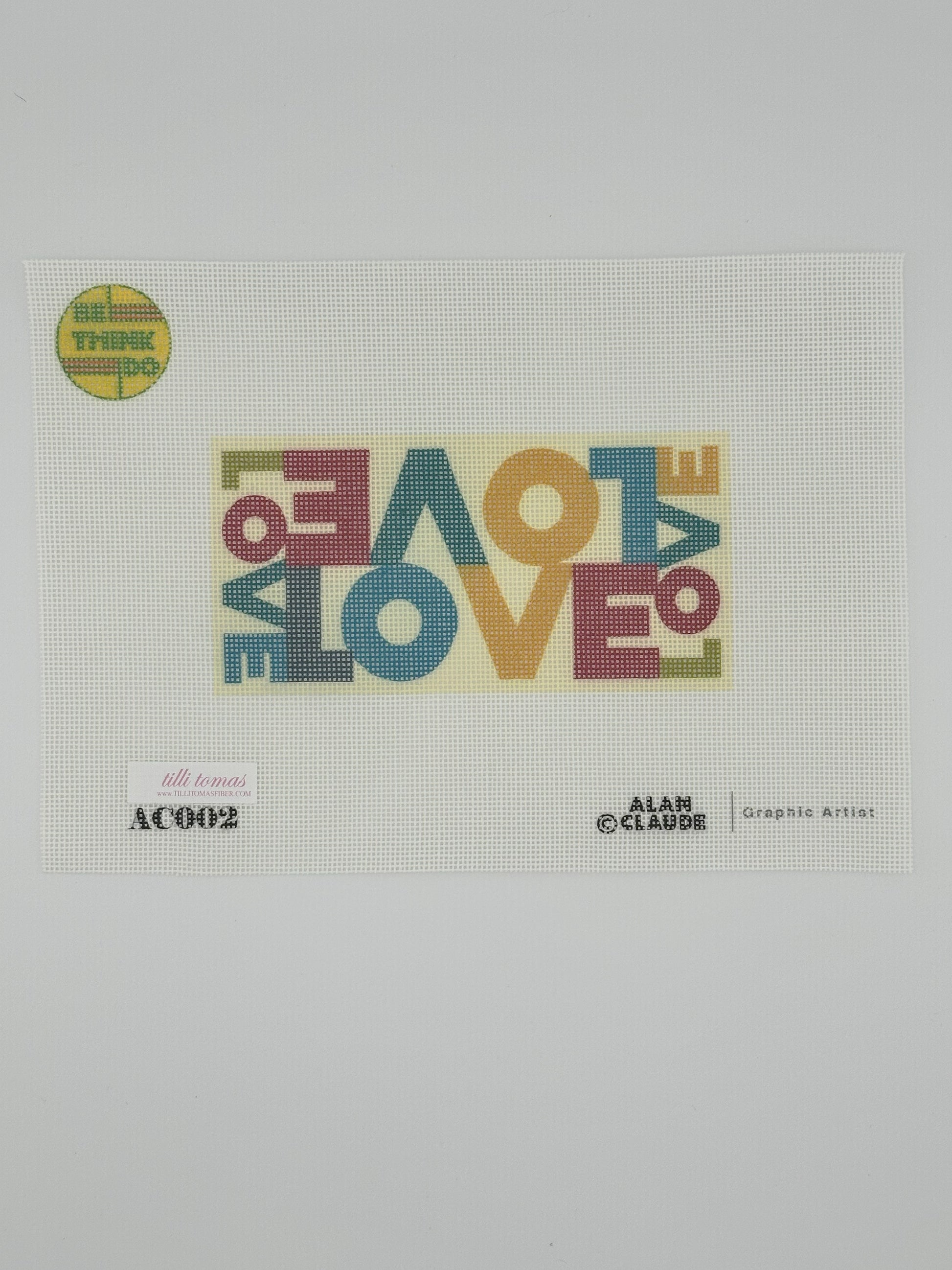 Love Canvas by Alan Claude — 18-mesh needlepoint canvas with multicolored repeating word pattern on yellow background
