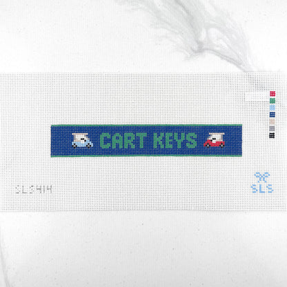 A needlepoint key fob canvas featuring a blue and green sign with the text 'CART KEYS' in green on 14 mesh lying flat on white background.