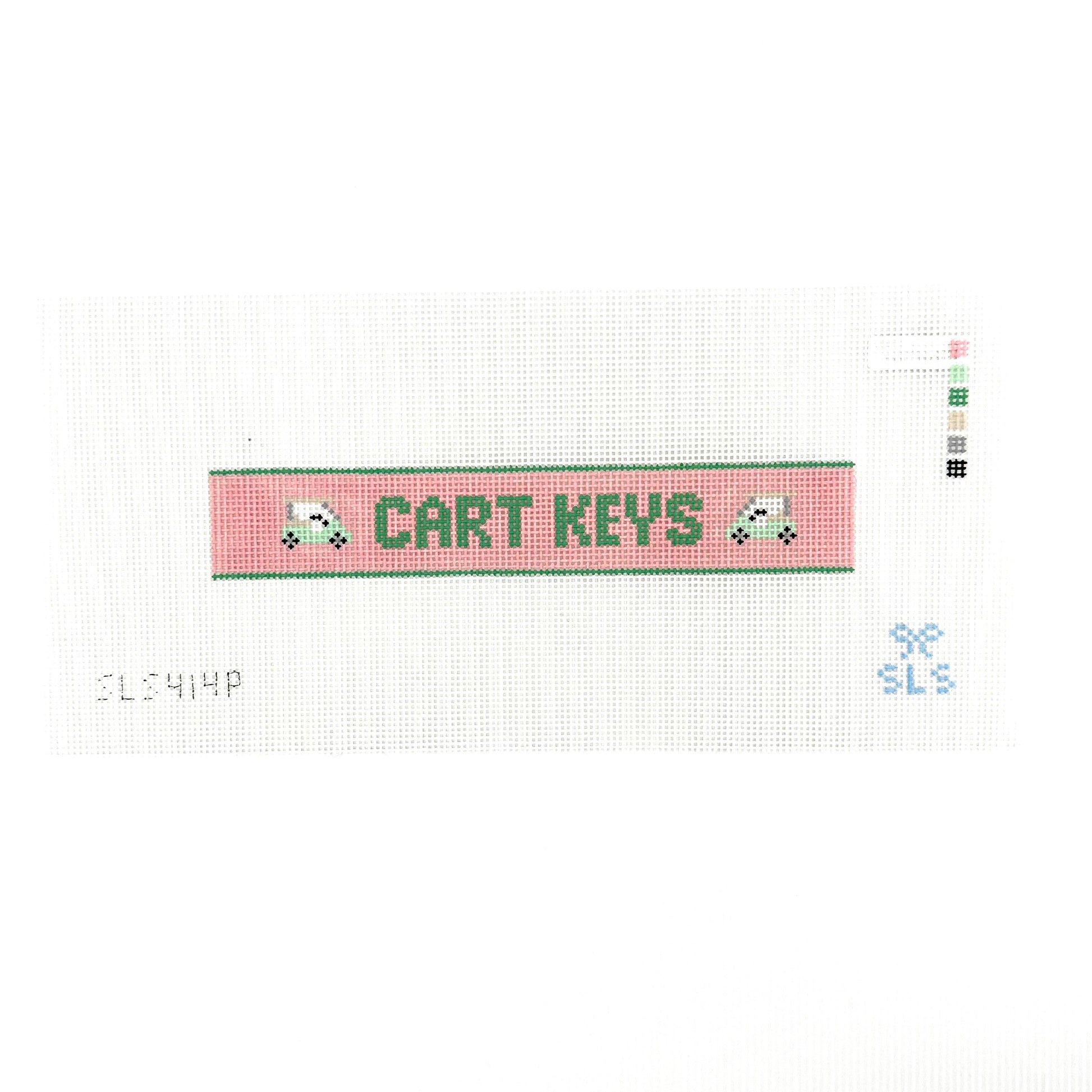 A needlepoint key fob canvas featuring a pink and green sign with the text 'CART KEYS' in green on 14 mesh lying flat on white background.