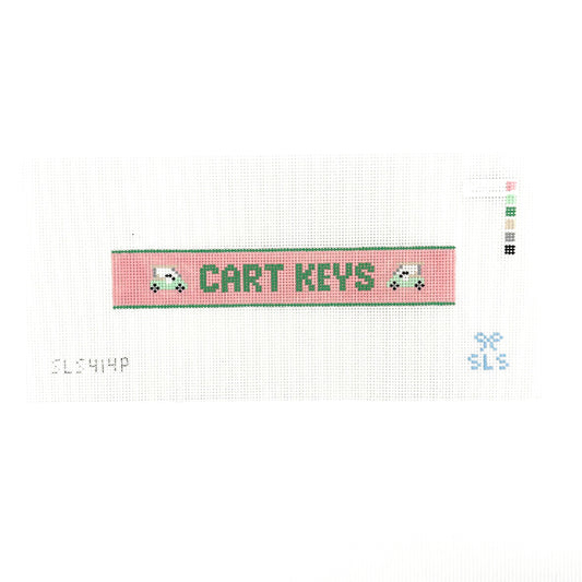 A needlepoint key fob canvas featuring a pink and green sign with the text 'CART KEYS' in green on 14 mesh lying flat on white background.