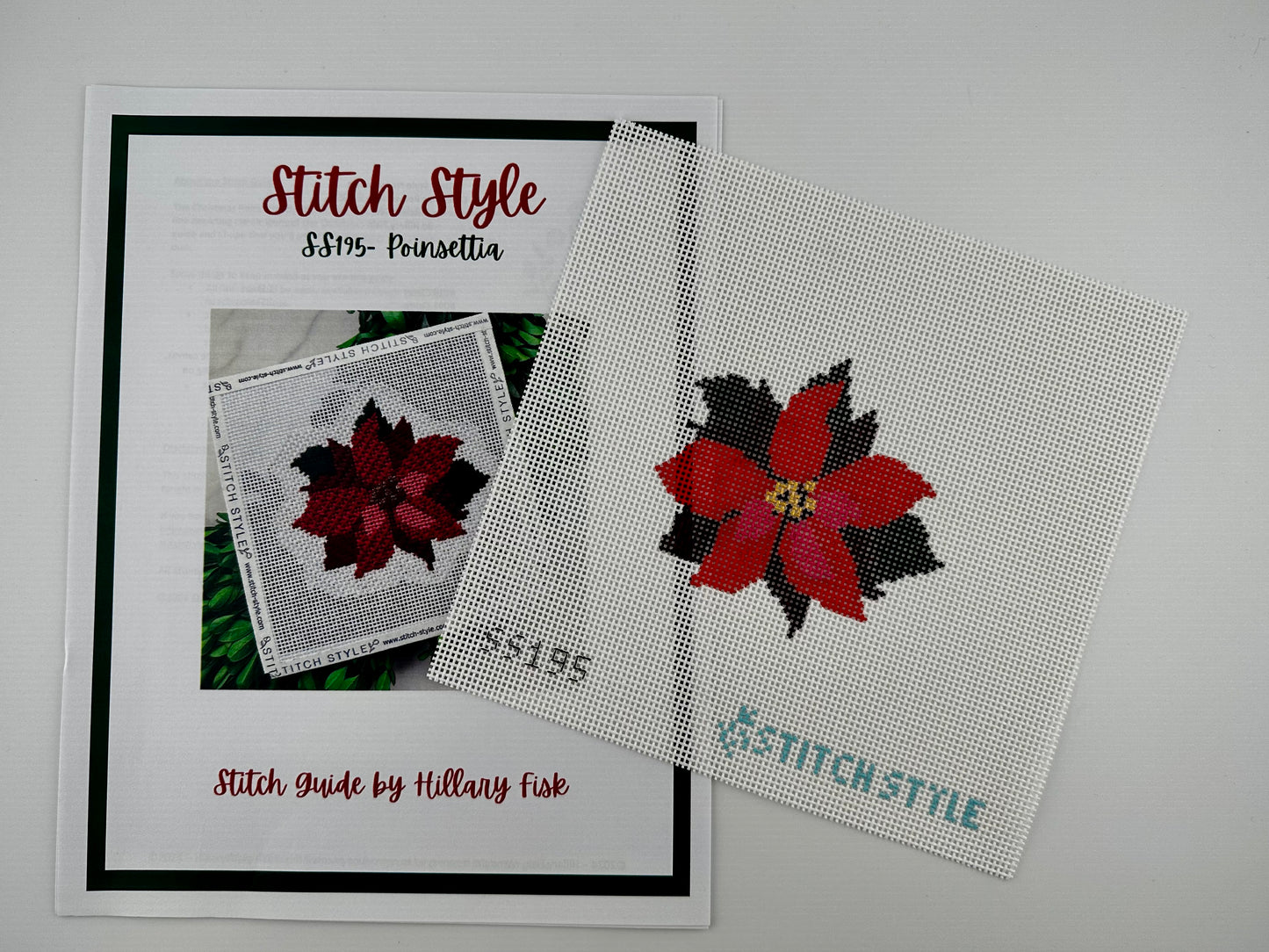 13 mesh needlepoint canvas featuring a red poinsettia flower on a white background. The text 'SS195' appears in black at the bottom left, and 'STITCH-STYLE' is printed in teal at the bottom right. Shown with stitch guide.
