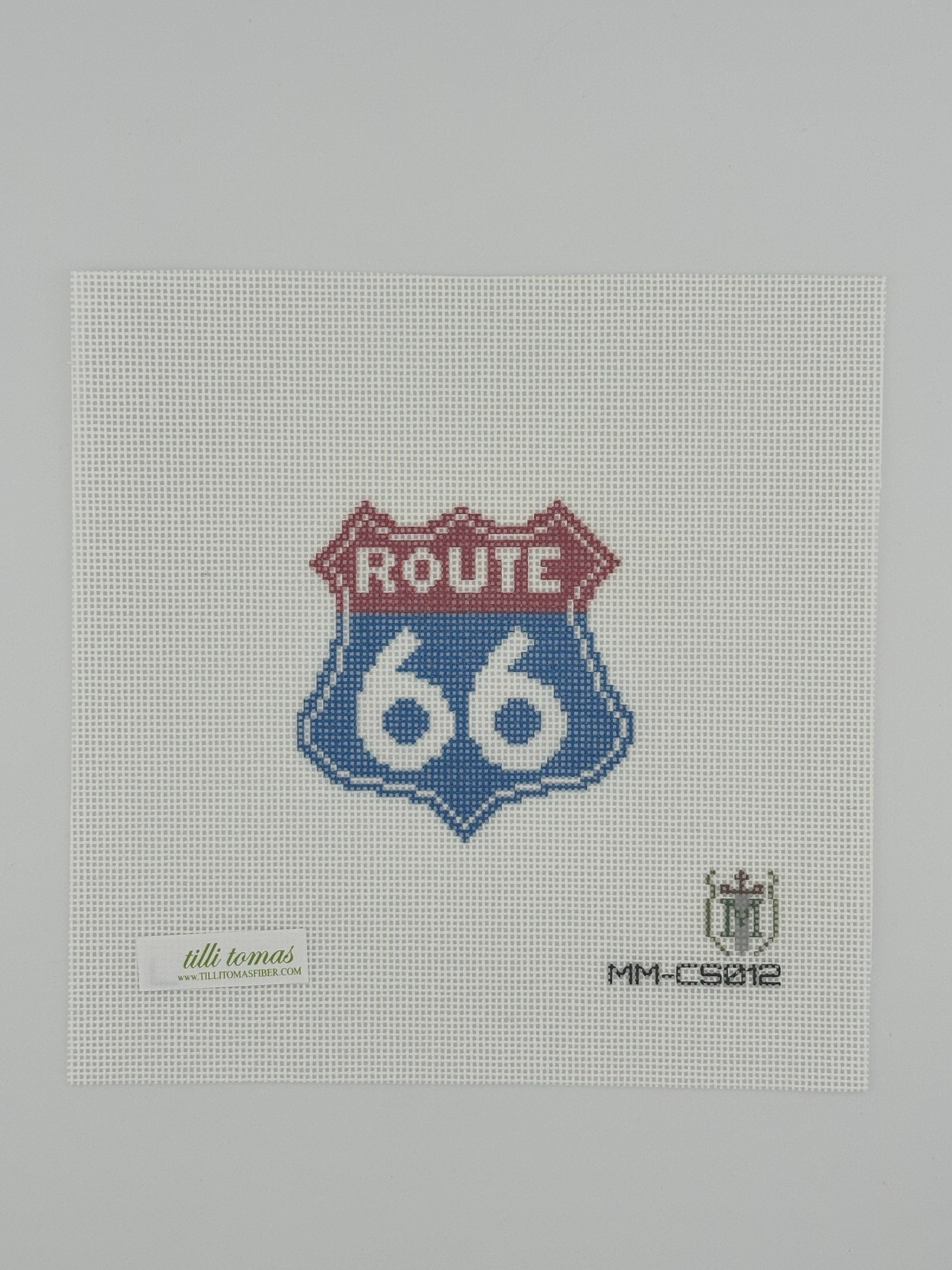Route 66 needlepoint canvas by Misty Morrow on 18 mesh in red and blue 3" x 3" square lying flat on white background.