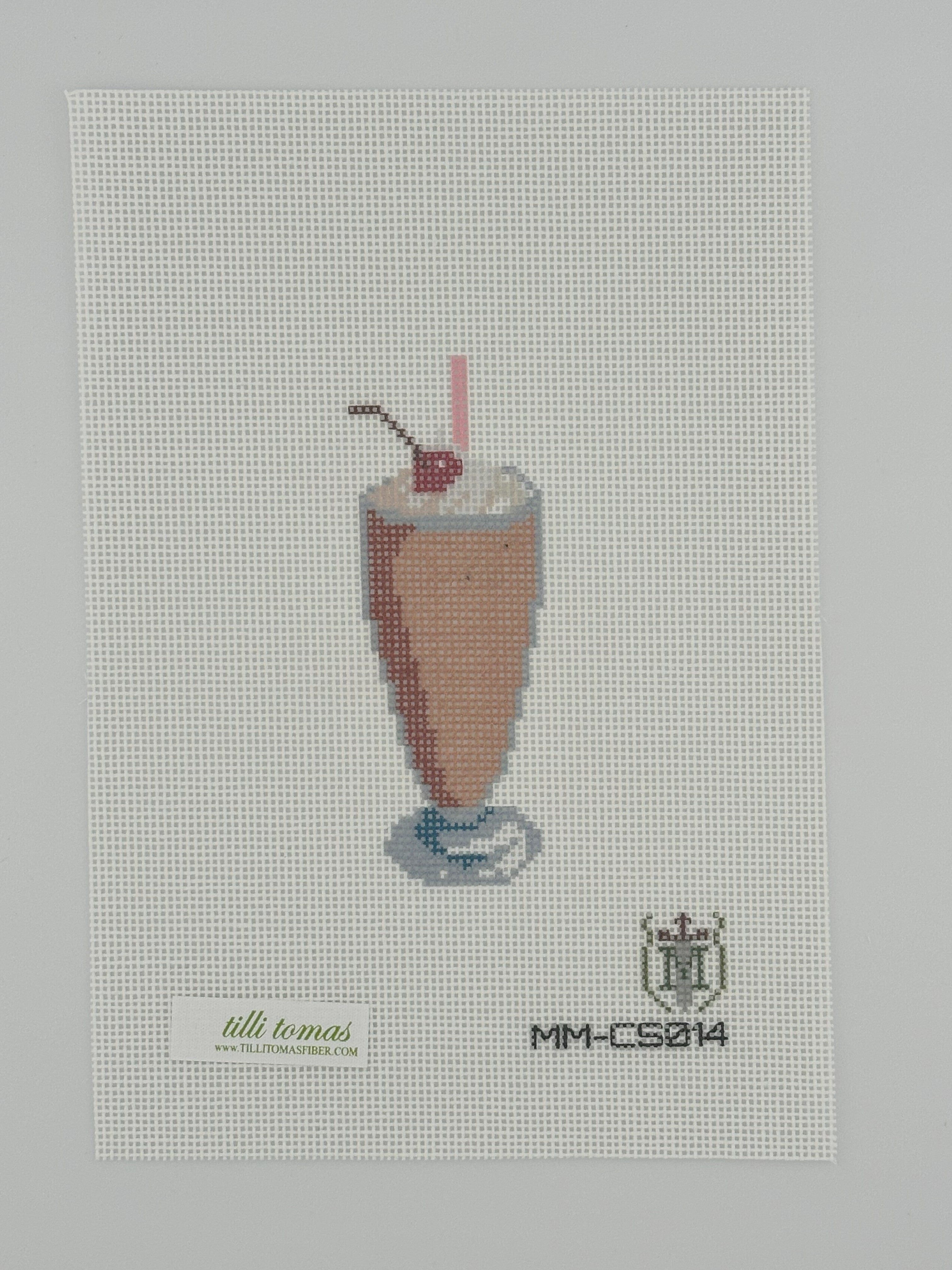 chocolate milkshake needlepoint canvas by misty morrow on 18 mesh 1.5" x4" lying flat on white background