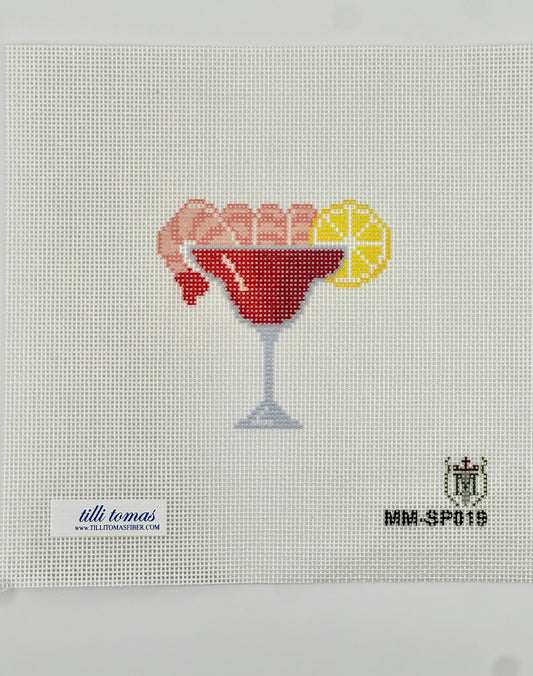 shrimp cocktail glass with a lemon wedge on 18 mesh needlepoint canvas laying flat on white background.