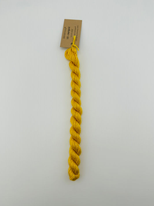 30 yard skein of silk & Ivory in the color 115 Marigold with brown tag laying flat on white background