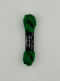 30 yard skein of Pepper Pot Silk needlepoint thread in rosemary 088, with black and white label lying flat on white background