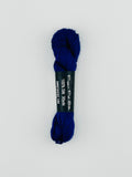 30 yard skein of Pepper Pot Silk needlepoint thread in amethyst 188, with black and white label lying flat on white background