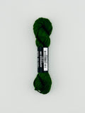 30 yard skein of Pepper Pot Silk needlepoint thread in Avocado 096 green, with black and white label lying flat on white background