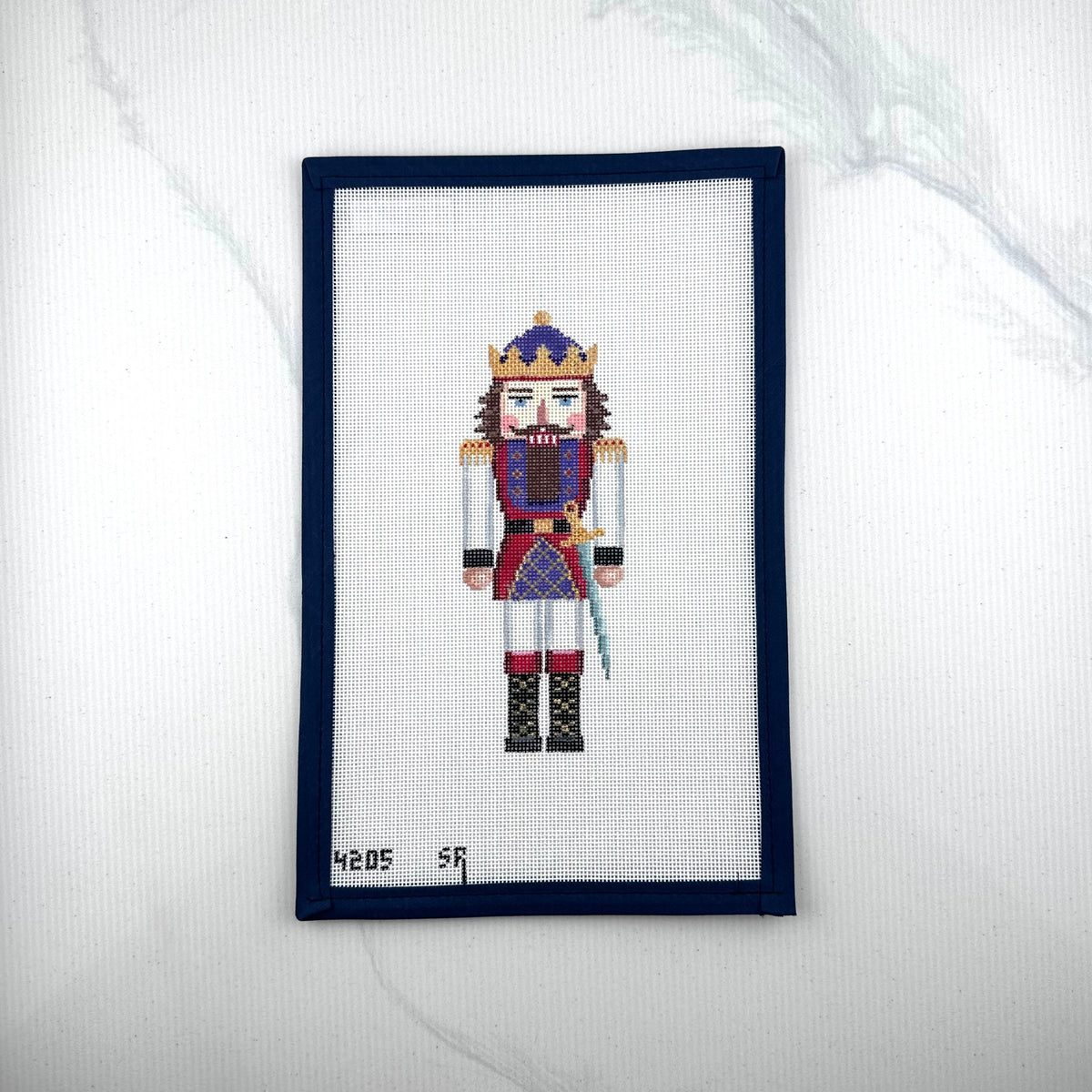 susan roberts king I nutcracker canvas, 18 mesh, 6.5" high lying flat on white background