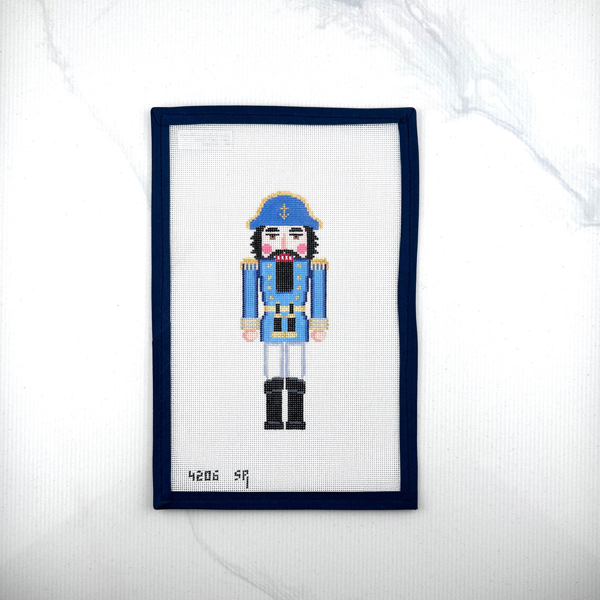 susan roberts blue sea captain nutcracker canvas, 18 mesh, 6.5" high lying flat on white background