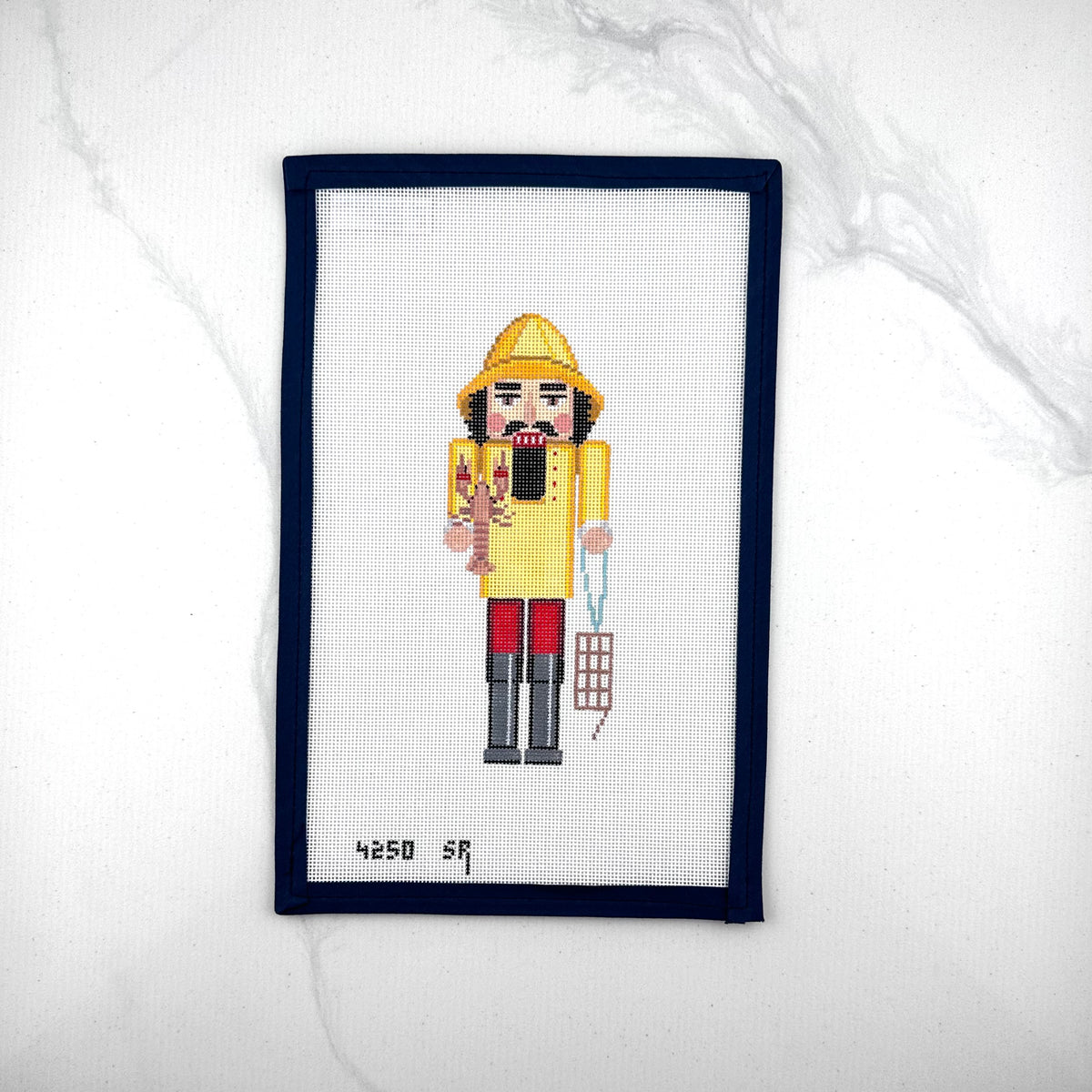 susan roberts yellow lobster catcher nutcracker canvas, 18 mesh, 6.5" high lying flat on white background