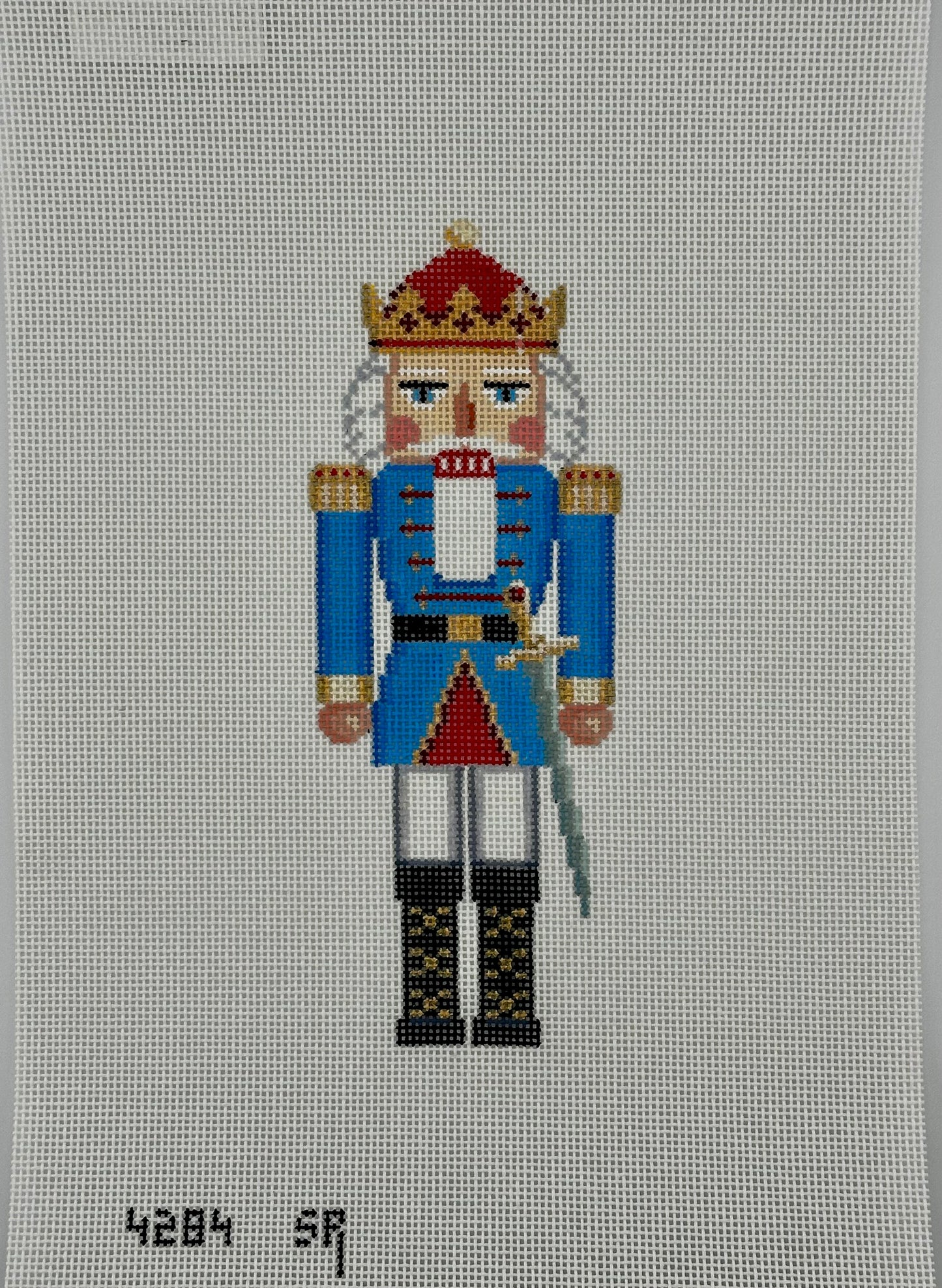 susan roberts aqua king nutcracker canvas, 18 mesh, 6.5" high lying flat on white background