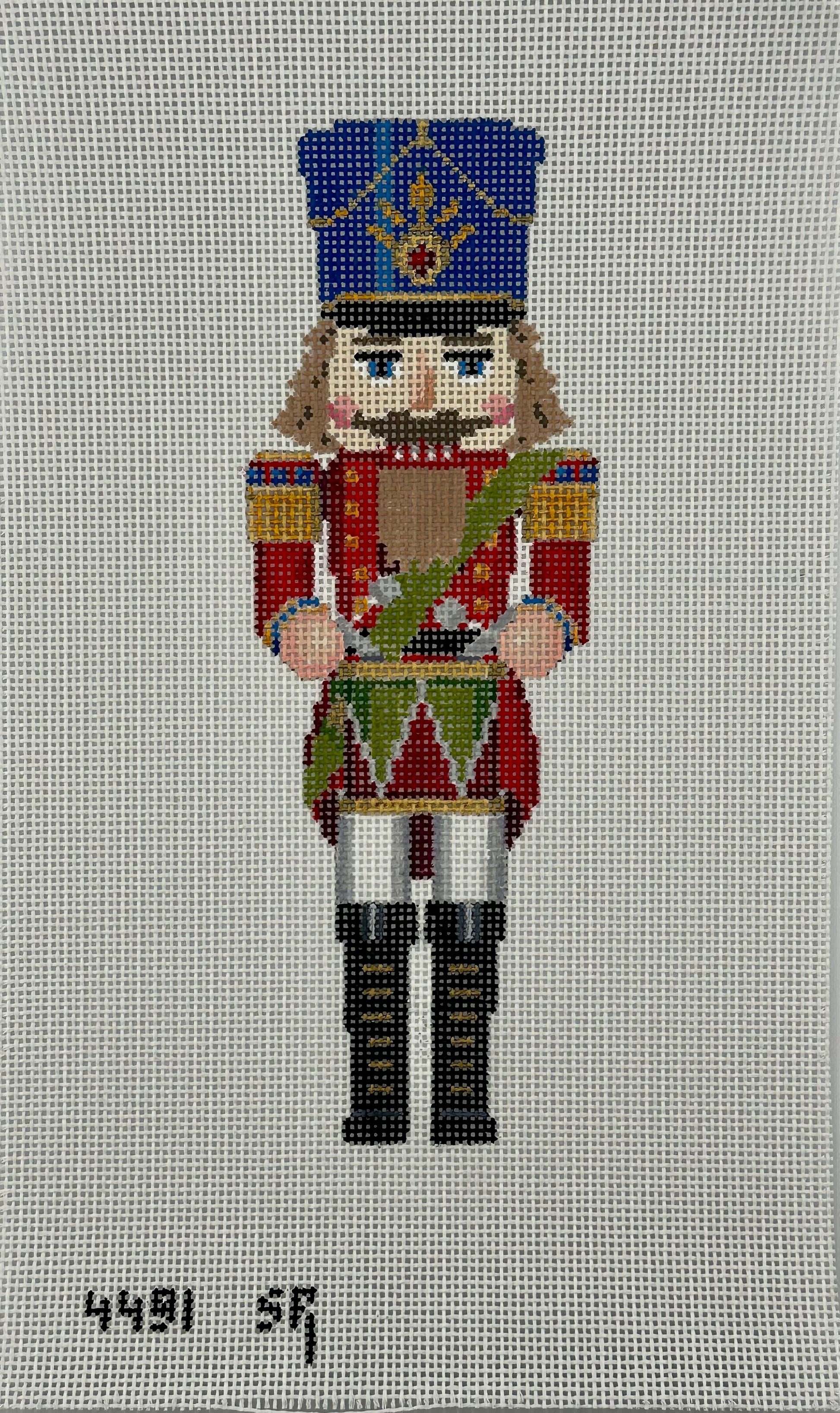 susan roberts drummer nutcracker canvas, 13 mesh, 9.5" high lying flat on white background