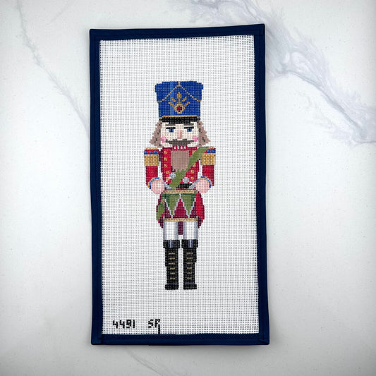 susan roberts drummer nutcracker canvas, 13 mesh, 9.5" high lying flat on white background