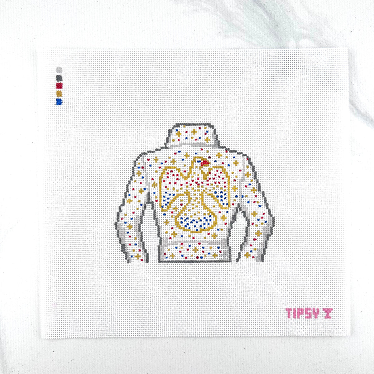 18  mesh The King needlepoint canvas featuring white Elvis style jacket and with red, gold, silver and blue sparkle to look like rhinestones outlined with gold stitching on a white fabric background. The text 'TIPSY' appears in red at the bottom right.