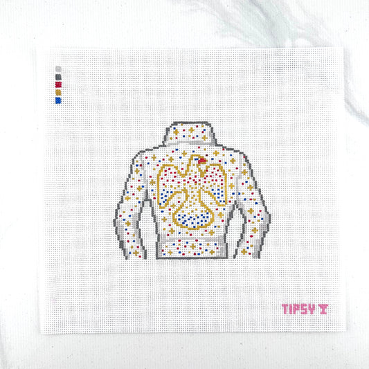 18  mesh The King needlepoint canvas featuring white Elvis style jacket and with red, gold, silver and blue sparkle to look like rhinestones outlined with gold stitching on a white fabric background. The text 'TIPSY' appears in red at the bottom right.