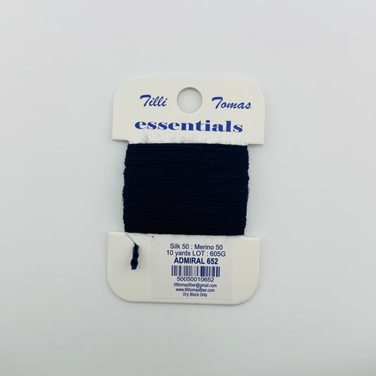 Tilli Tomas Essentials needlepoint thread, in dark navy blue admiral 652.  50% silk, 50% merino wool, 10 yards wound on a white cardboard card.