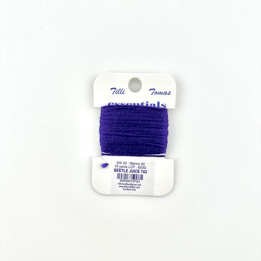 Tilli Tomas Essentials needlepoint thread, in purple color beetle juice 743.  50% silk, 50% merino wool, 10 yards wound on a white cardboard card.