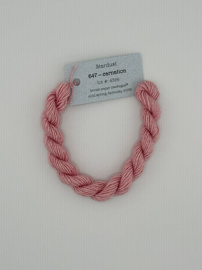 30 yard skein of Stardust Silk and Ivory needlepoint thread in Carnation 647, with light blue label lying flat on white background