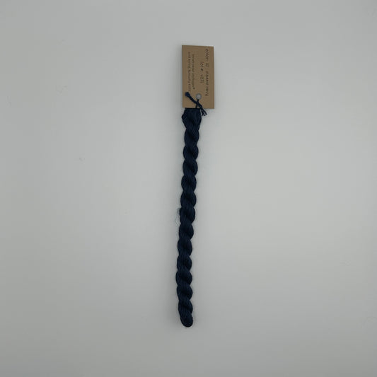 30 yard skein of silk & Ivory in the color 10 Classic Navy with brown tag laying flat on white background