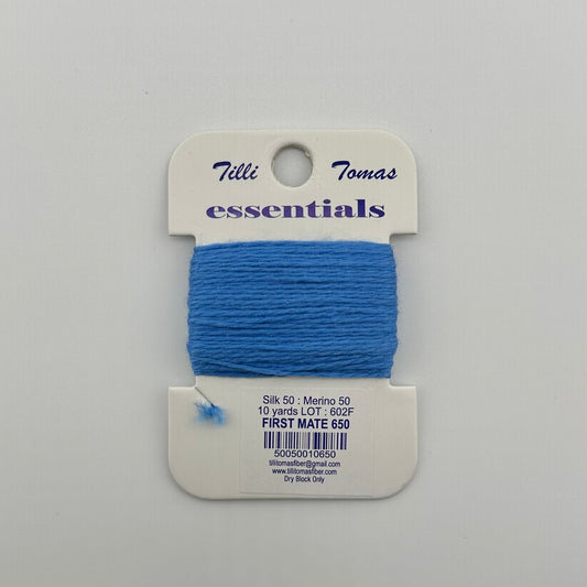 Tilli Tomas Essentials needlepoint thread, in blue first mate 650.  50% silk, 50% merino wool, 10 yards wound on a white cardboard card.
