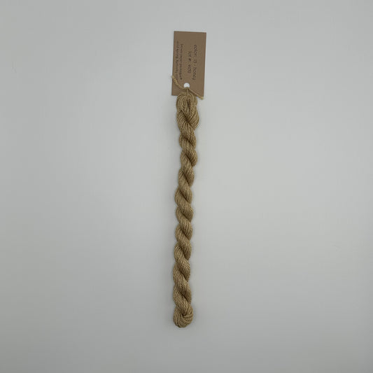 30 yard skein of silk & Ivory in the color 15 Honey with brown tag laying flat on white background