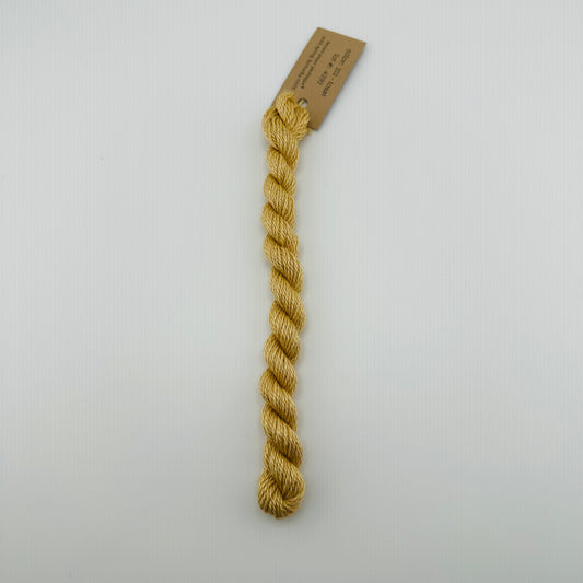 30 yard skein of silk & Ivory in the color 212 Toast with brown tag laying flat on white background