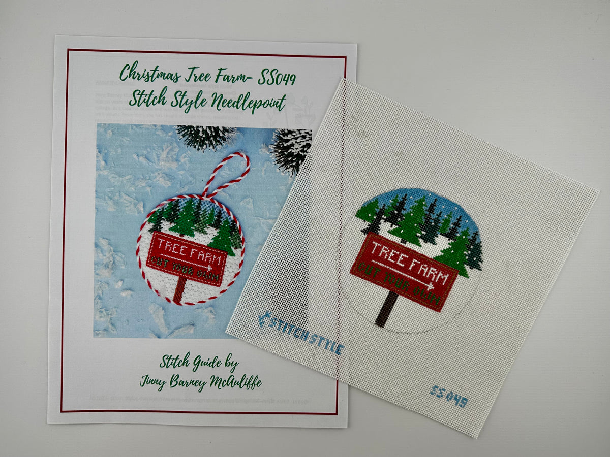 18 mesh needlepoint canvas featuring a design of a red 'Tree Farm' sign with a white arrow pointing right, set against a snowy pine tree landscape under a blue sky. The canvas is displayed on a white background with Stitch-Style branding and product code printed on the bottom. shown with stitch guide.