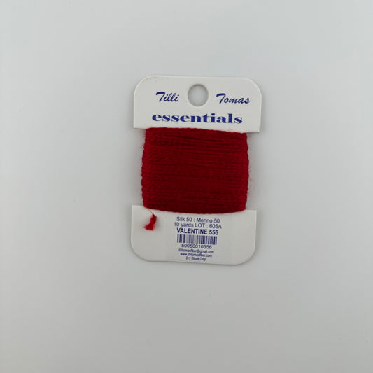 Tilli Tomas Essentials needlepoint thread, in red valentine 556.  50% silk, 50% merino wool, 10 yards wound on a white cardboard card.