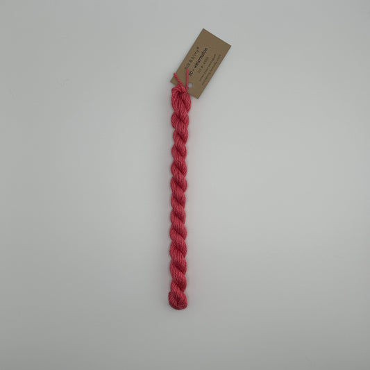 30 yard skein of silk & Ivory in the color 50 Watermelon with brown tag laying flat on white background