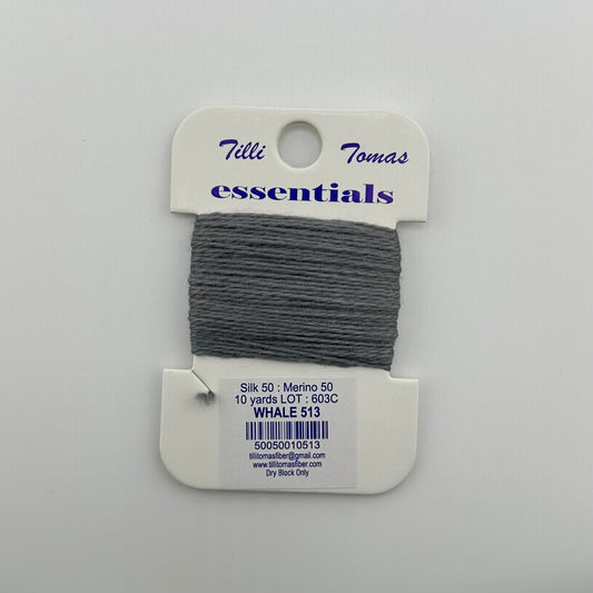 Tilli Tomas Essentials needlepoint thread, in grey whale 513.  50% silk, 50% merino wool, 10 yards wound on a white cardboard card.